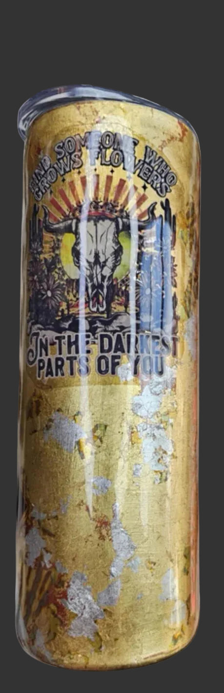 Find someone who grows flowers in the darkest parts of you 20 oz tumbler