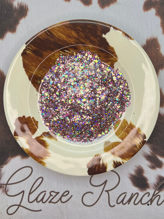 Decorative plate with glittery center on a cow print background with 'Glaze Ranch' branding.