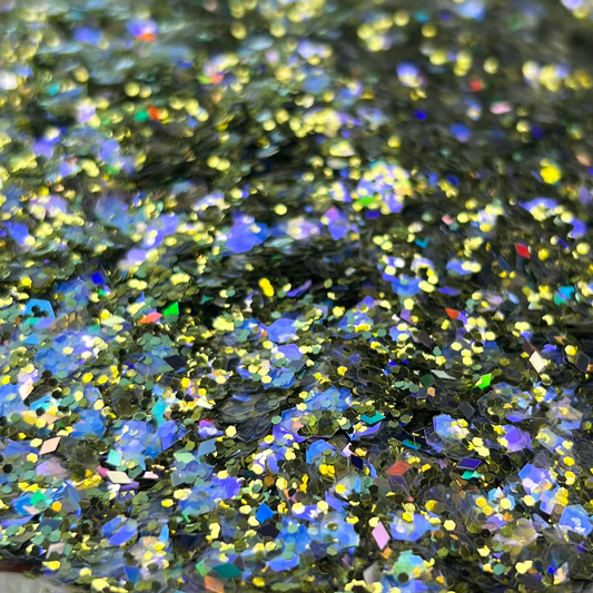 Decorative plate with glittery green substance on a patterned surface