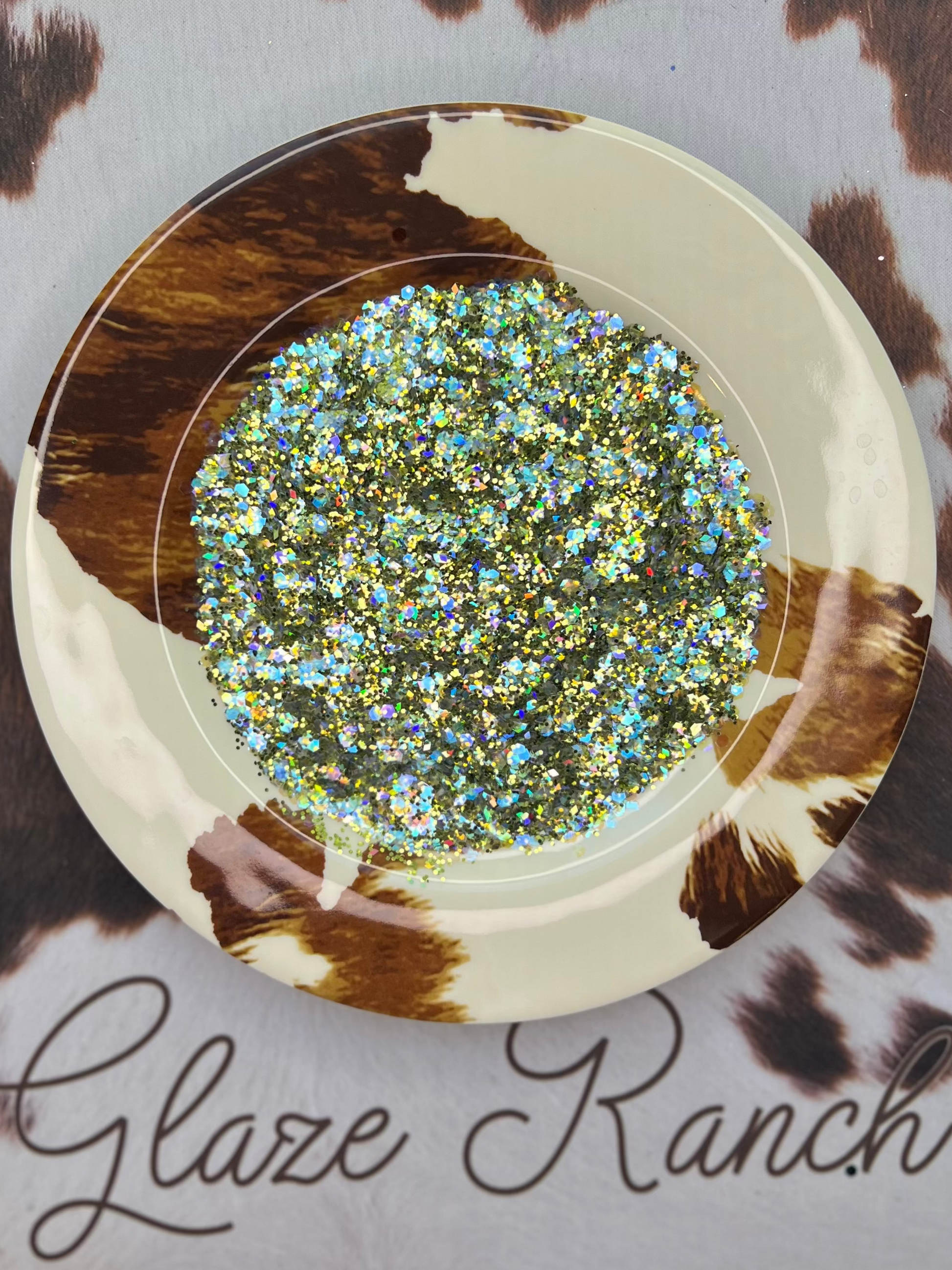 Glitter container with a cow print background and 'Glaze Ranch' branding.