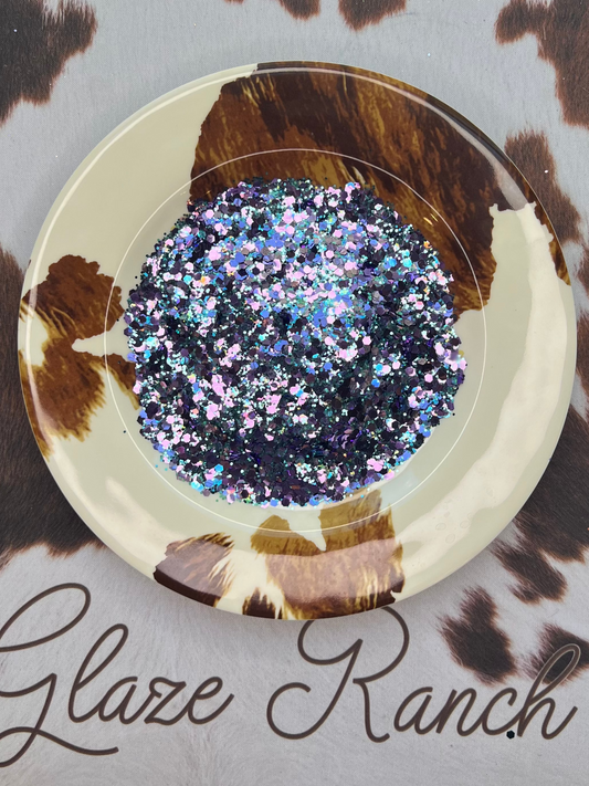 Decorative item with glittery center on a cow print background with 'Glaze Ranch' branding.