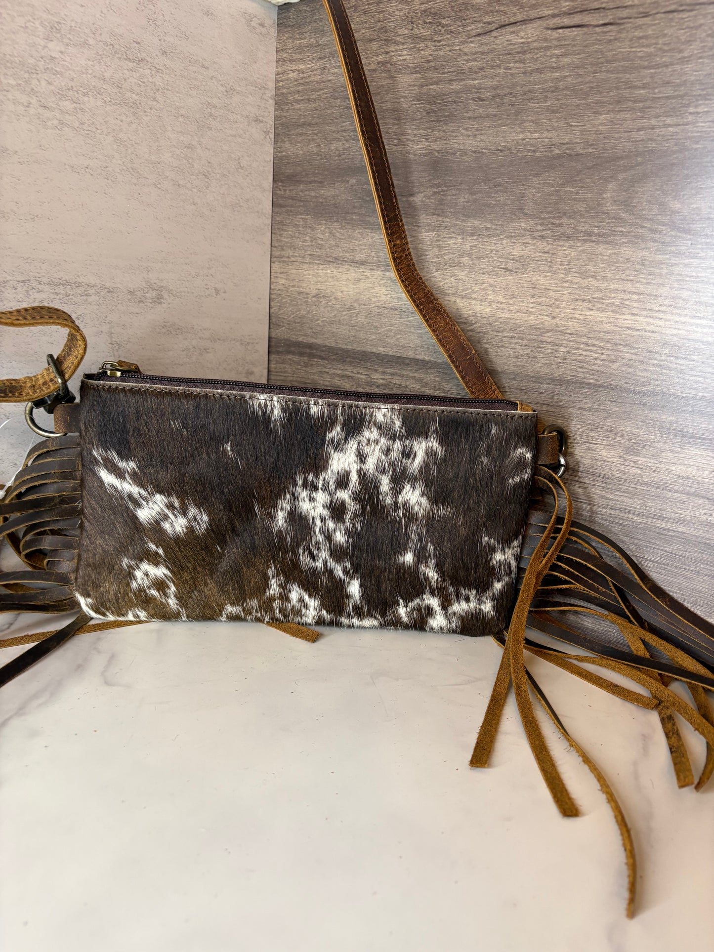 Crossbody cowhide bag with fringe