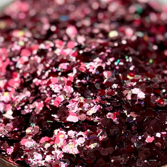 Mixed pink and red glitter on a cowhide print plate.