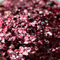 Mixed pink and red glitter on a cowhide print plate.
