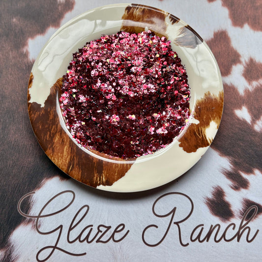 Decorative bowl with pink glitter on a cowhide surface with 'Glaze Ranch' branding.