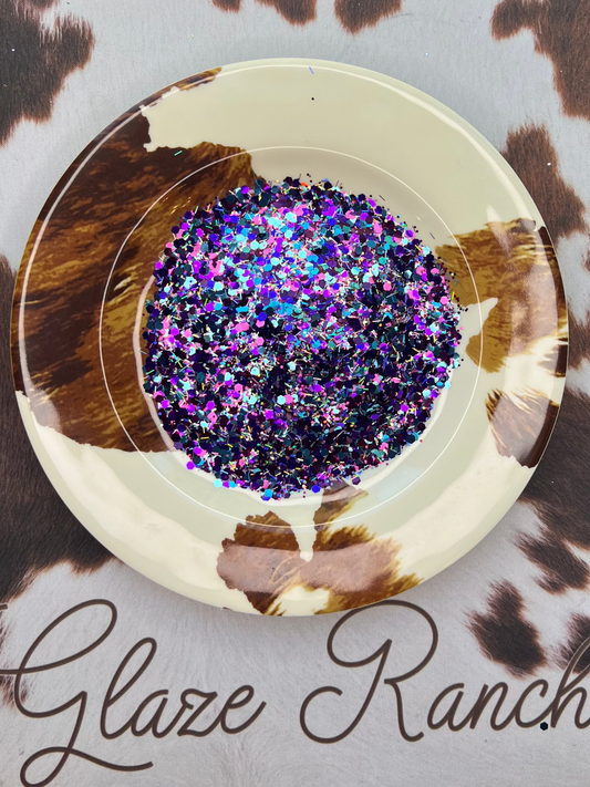 Decorative item with glittery center on a cow print background, branded 'Glaze Ranch'.