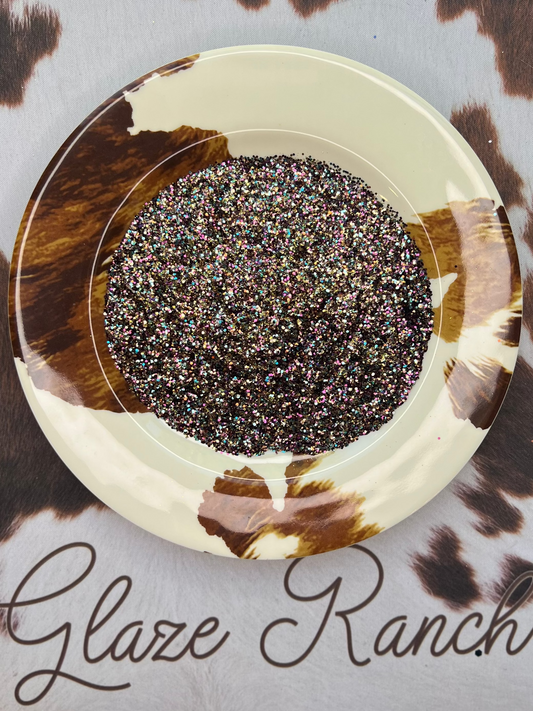 Decorative plate with a circular design on a cowhide surface with 'Glaze Ranch' branding.