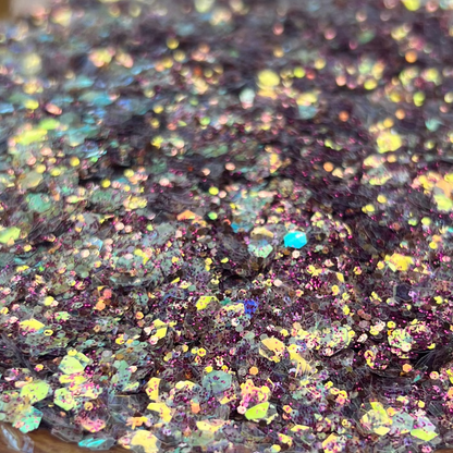Iridescent glitter on a decorative plate with a blurred background
