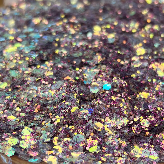 Iridescent glitter on a decorative plate with a blurred background